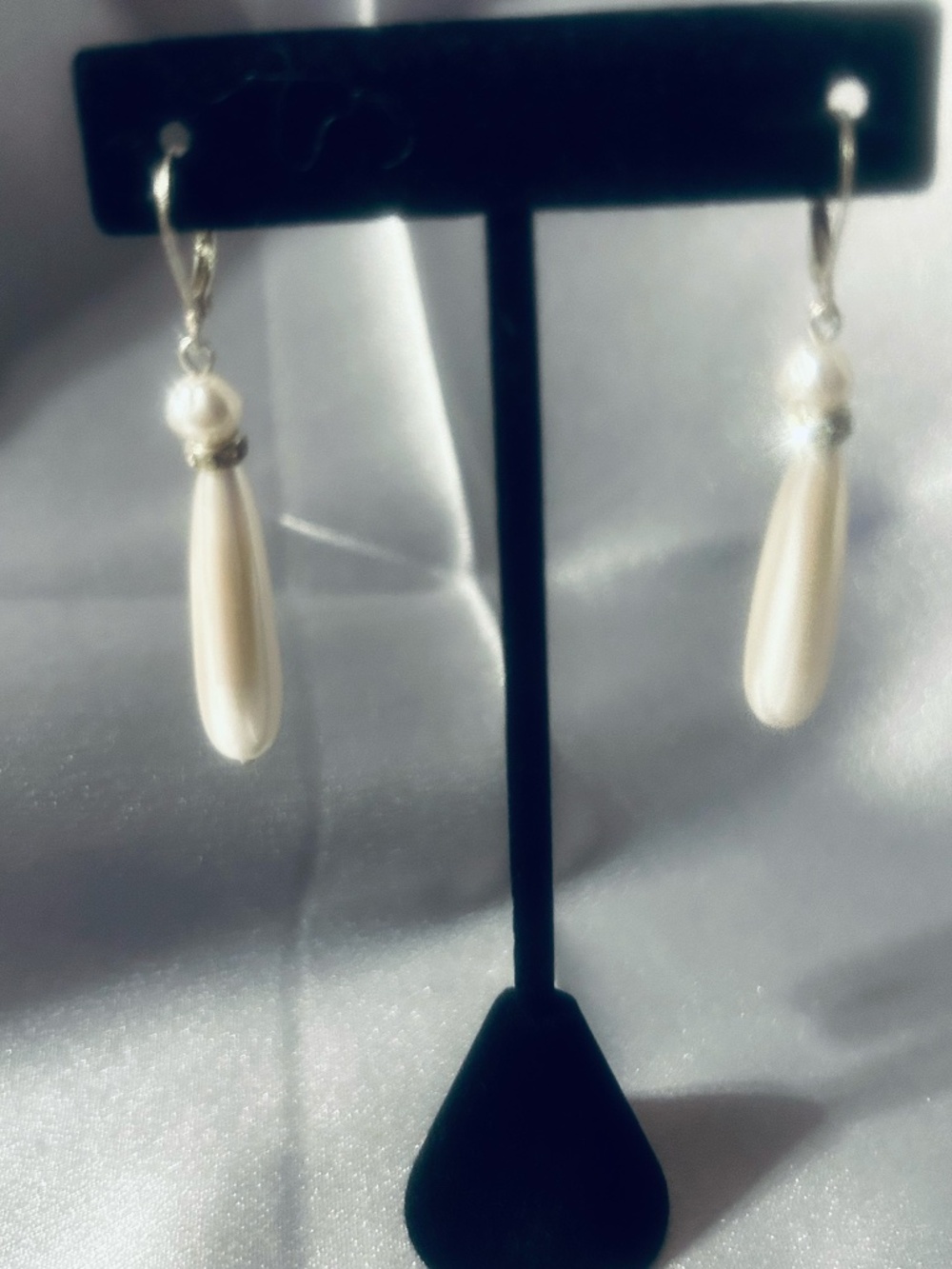Pearl drop earrings with diamond accents